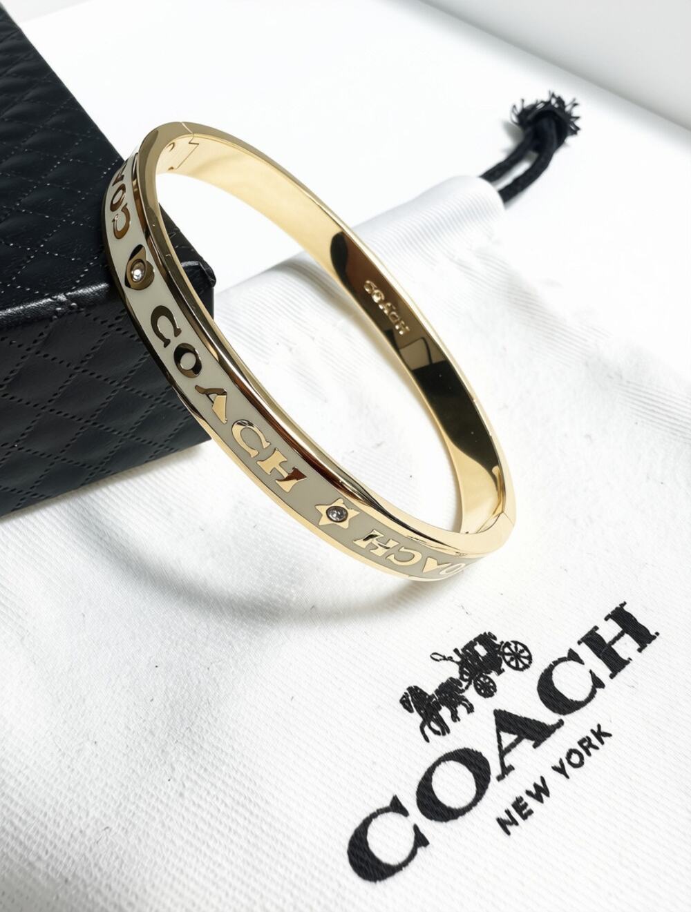 COACH Kissing C hinged bangle